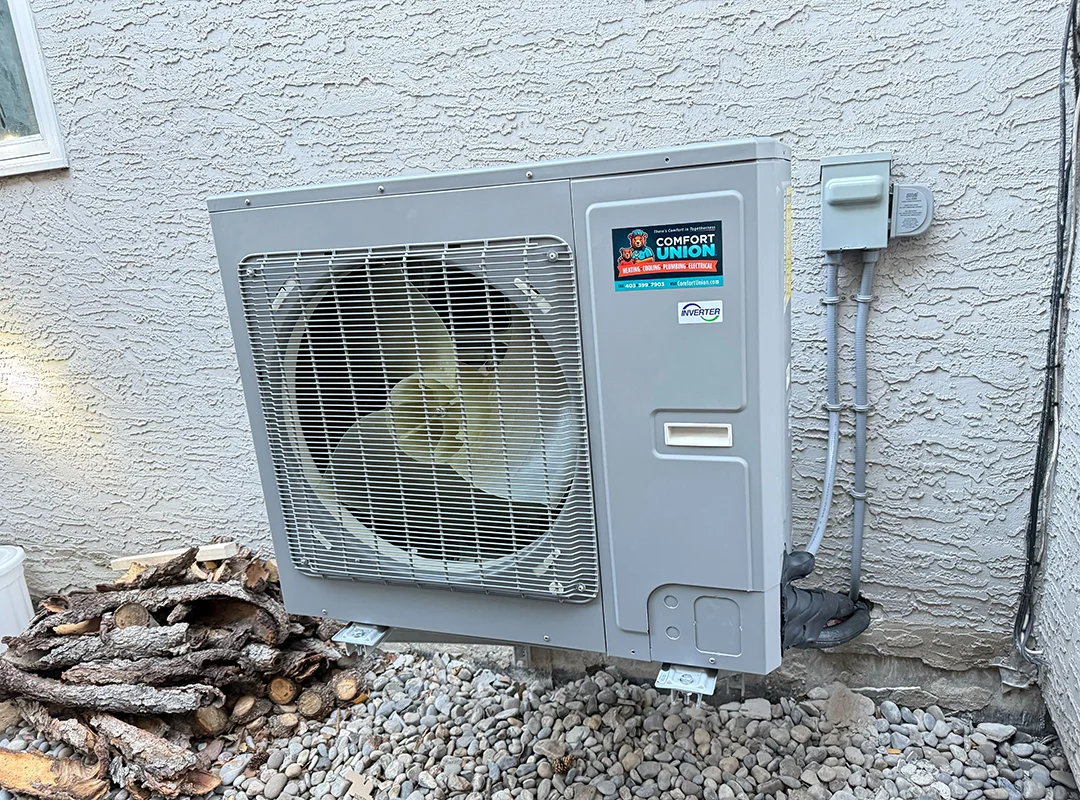 Energy-efficient outdoor heat pump unit professionally installed by Comfort Union