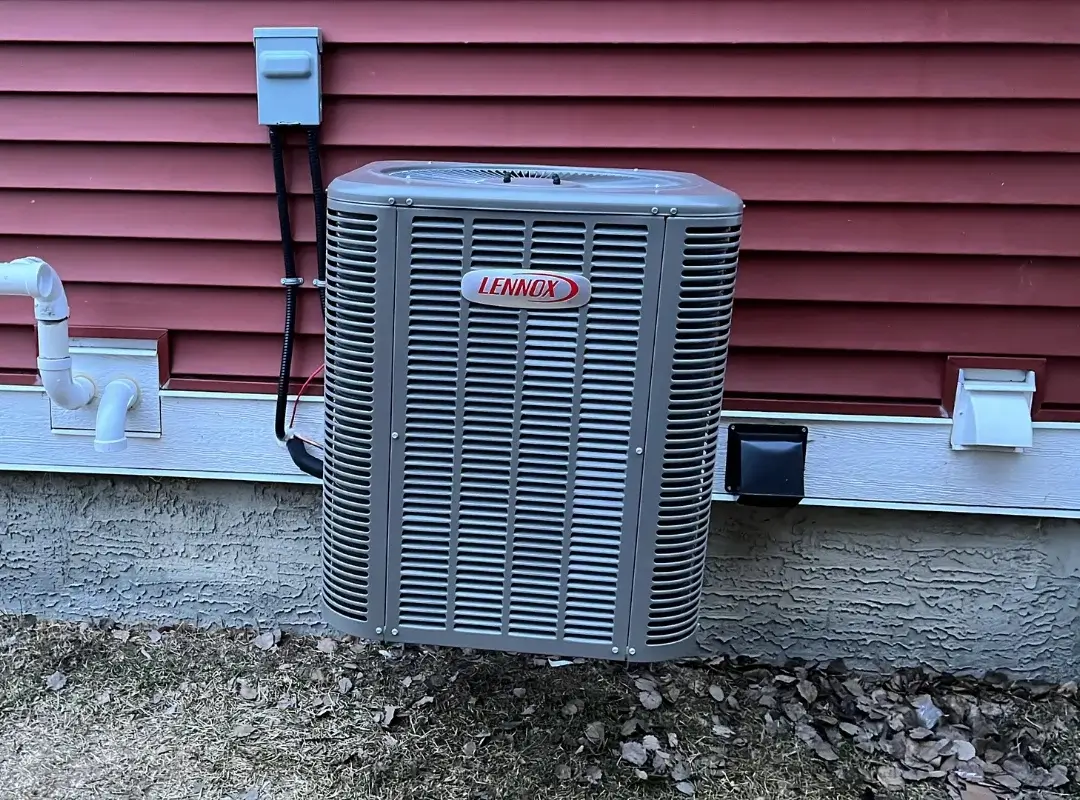 New Lennox air conditioner installed outside Cochrane residence by Comfort Union